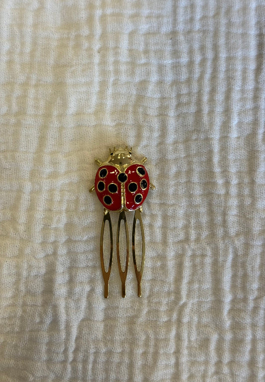 Peinecillo mariquita roja